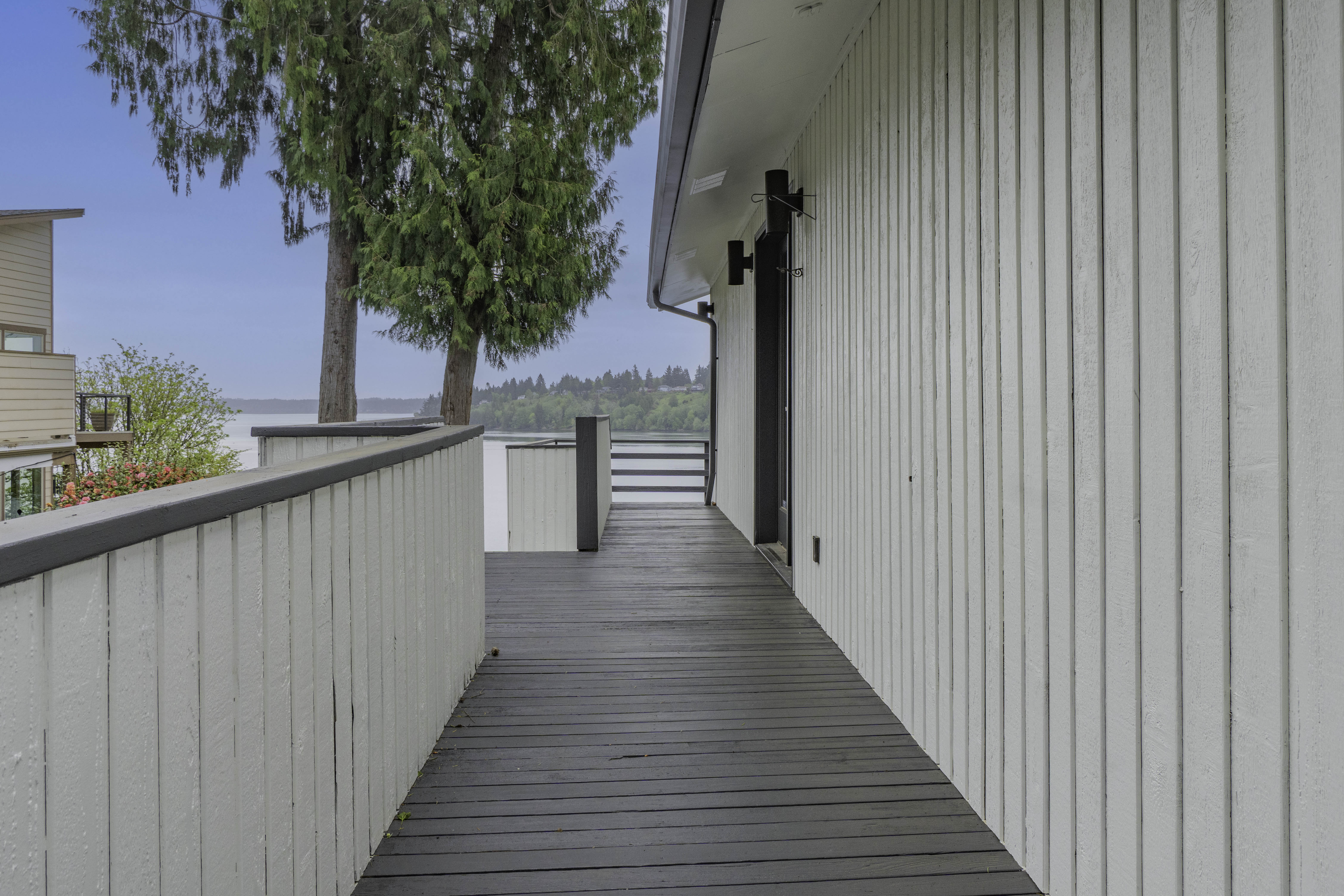 Wraparound deck with Totten Inlet views at 461 SE Kamilche Shores Rd
