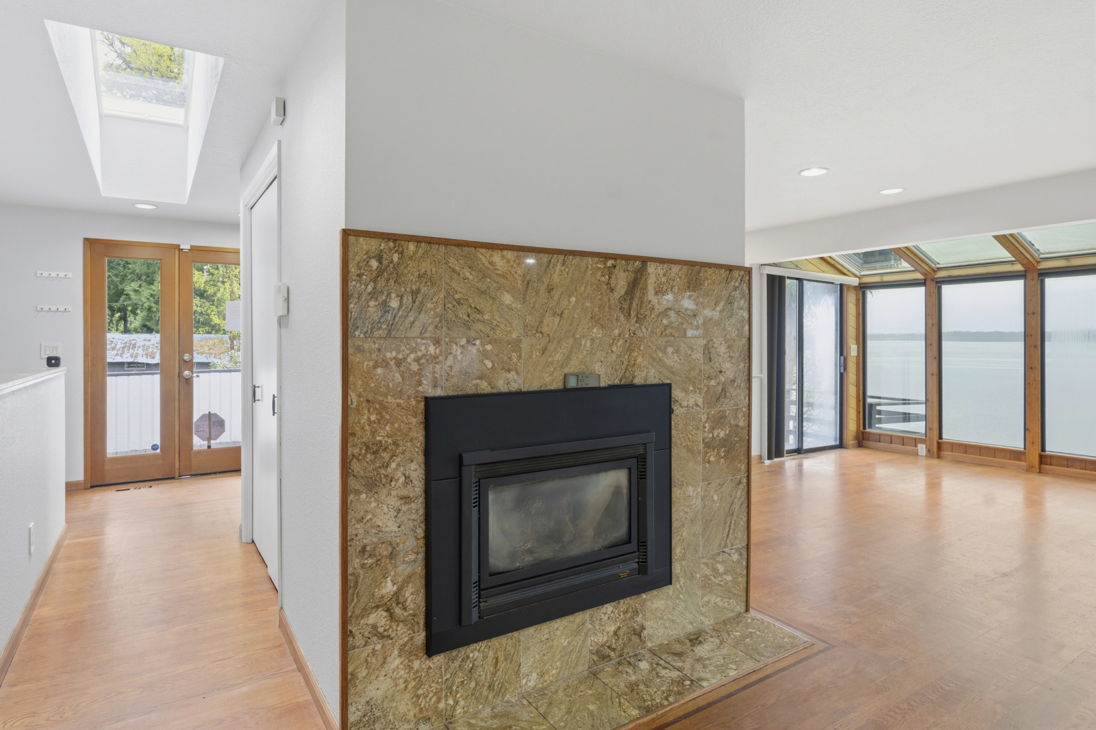 Open living and dining area with hardwood floors
