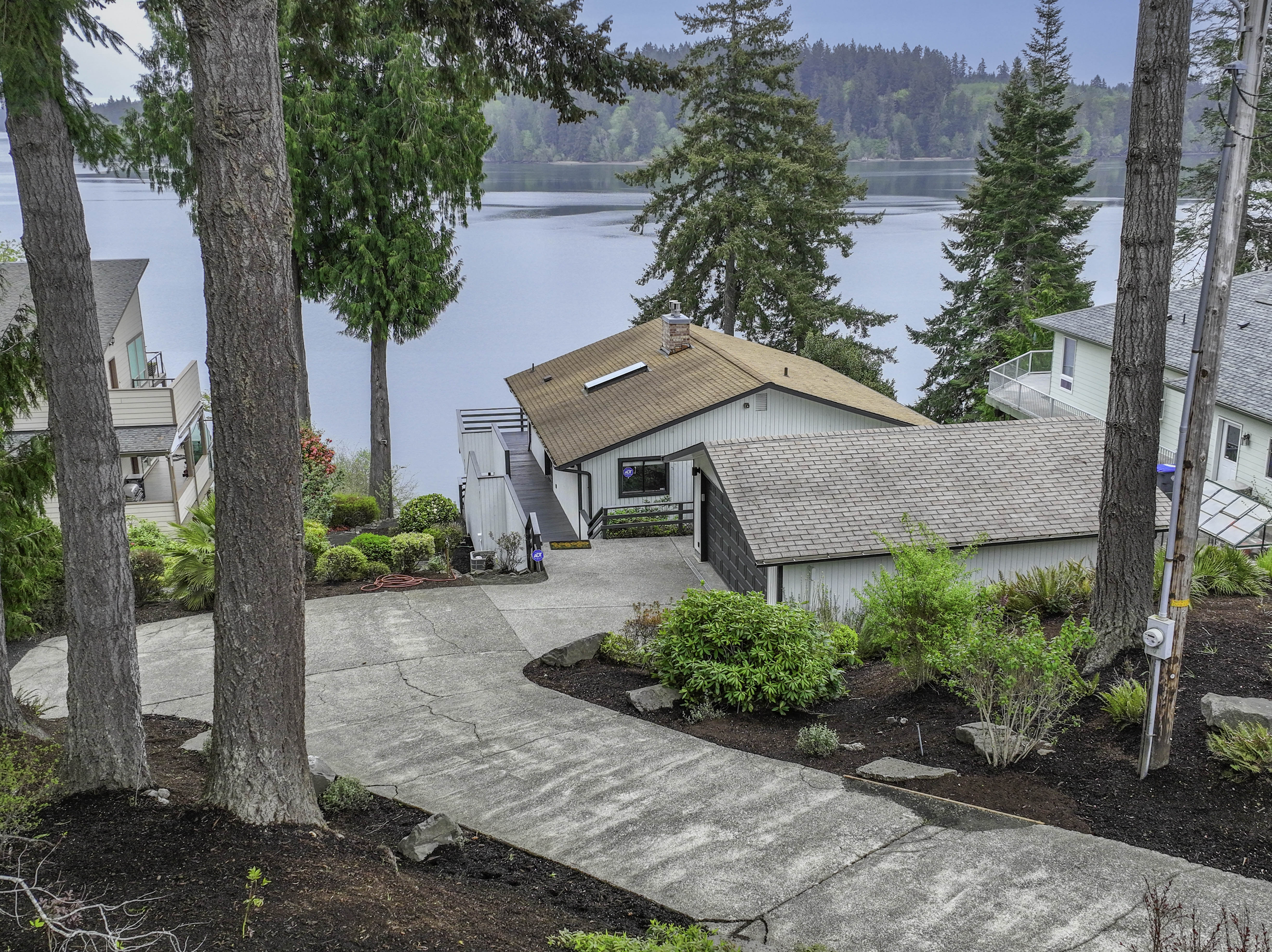 Aerial view of 461 SE Kamilche Shores Rd waterfront home on Totten Inlet